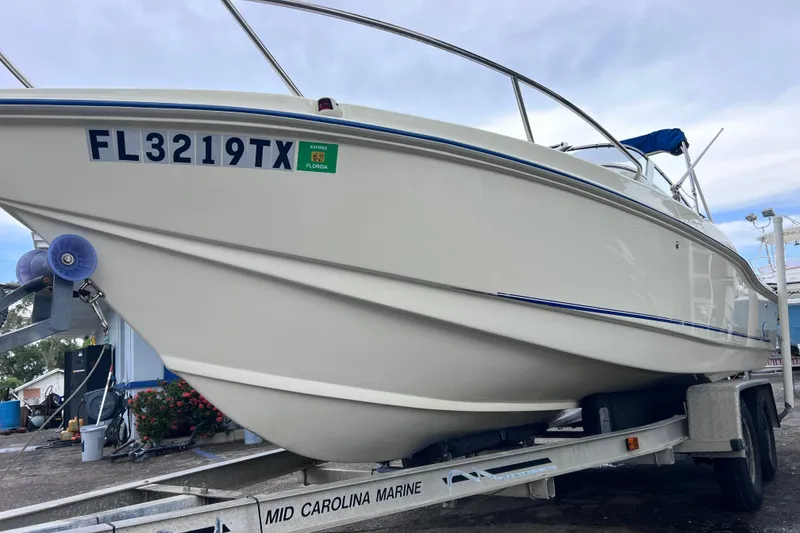 Slide: The Image of 2001 Scout 202 Dorado boat on trailer, Florida registration visible. - 3