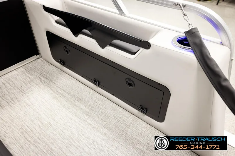 Slide: The Image of Interior of 2026 Avalon LSZ ENT boat with storage compartment and cup holder. - 33