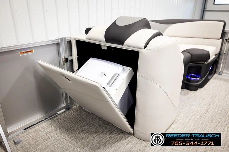 Slide: The Image of 2026 Avalon LSZ ENT boat interior with storage compartment and seating. - 21