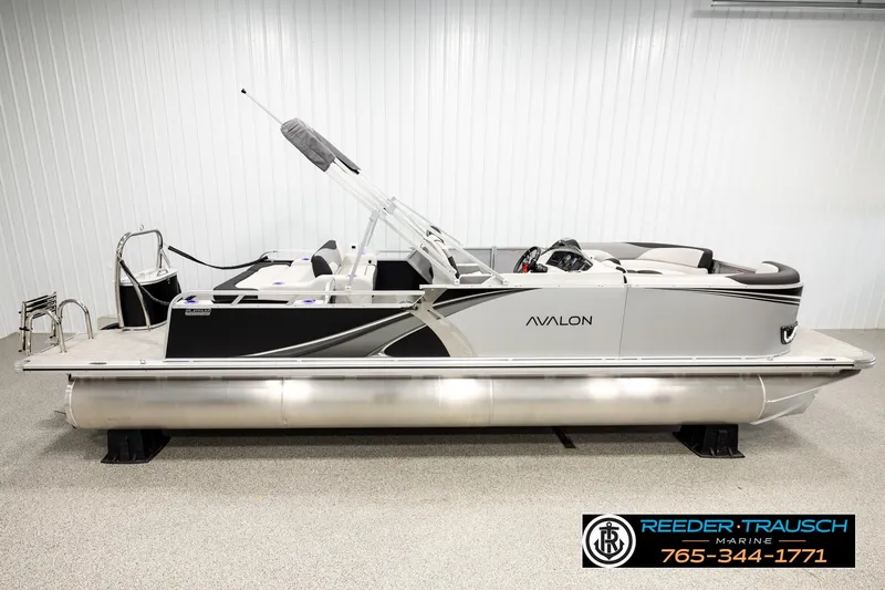 The Image of 2026 Avalon LSZ ENT pontoon boat in showroom, side view, Reeder Trausch Marine. - 1