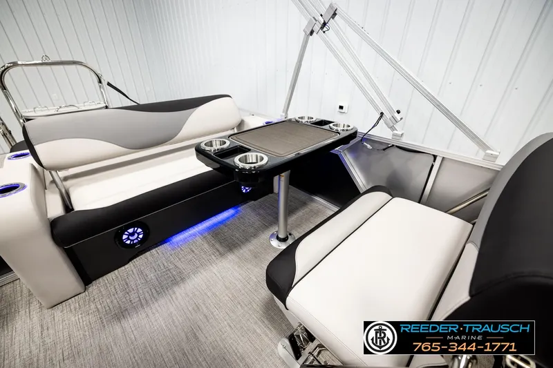 Slide: The Image of Luxurious interior of 2026 Avalon LSZ ENT pontoon boat with seating and table. - 28