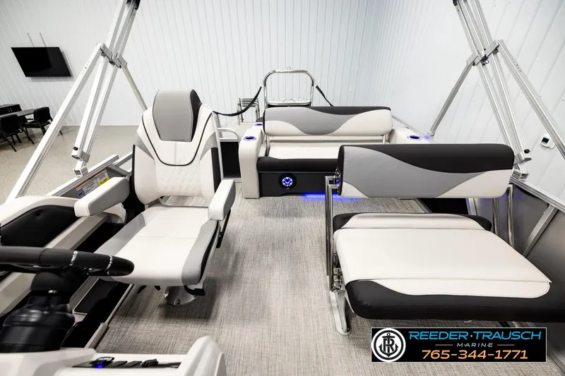 Slide: The Image of 2026 Avalon LSZ ENT pontoon boat interior with modern seating and steering console. - 14