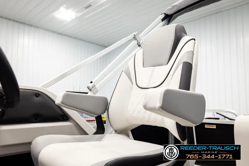 Slide: The Image of 2026 Avalon LSZ ENT boat seat in a modern, well-lit showroom. - 45
