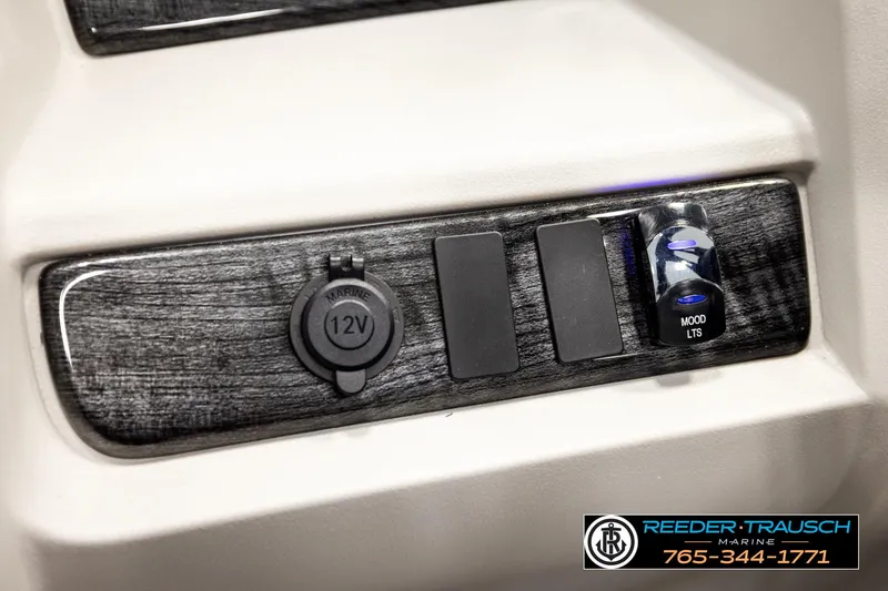 Slide: The Image of 2026 Avalon LSZ ENT control panel with 12V outlet and mood lighting switch. - 38