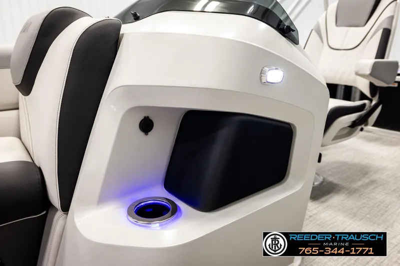 Slide: The Image of 2026 Avalon LSZ ENT boat interior with illuminated cup holder and modern seating design. - 48