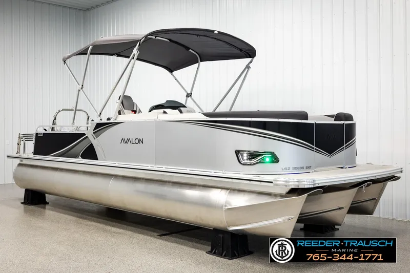 Slide: The Image of 2026 Avalon LSZ ENT pontoon boat with canopy in showroom. - 3