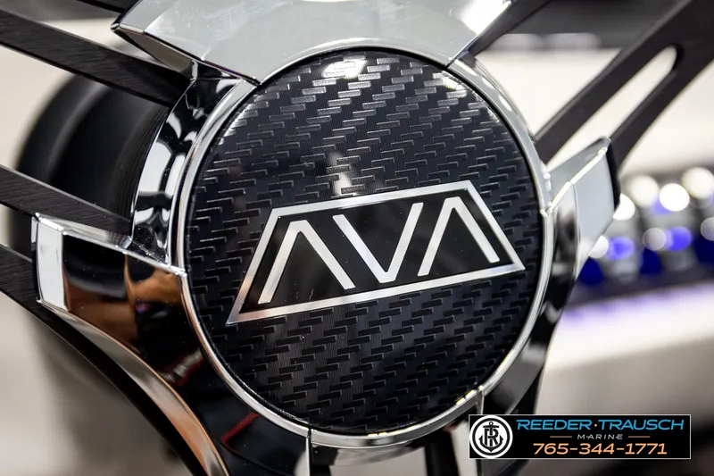 Slide: The Image of Close-up of 2026 Avalon LSZ ENT logo with carbon fiber texture and chrome accents. - 37