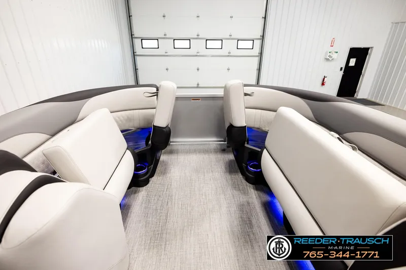 Slide: The Image of Luxurious interior of 2026 Avalon LSZ ENT pontoon boat with plush seating and ambient lighting. - 19