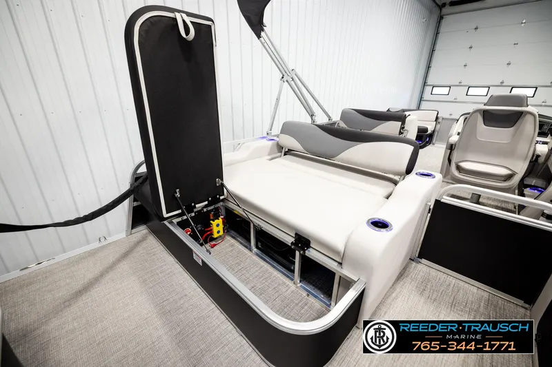 Slide: The Image of 2026 Avalon LSZ ENT pontoon boat interior with seating and storage compartments. - 32