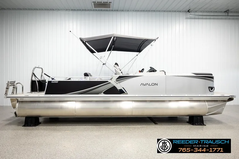 Slide: The Image of 2026 Avalon LSZ ENT pontoon boat with canopy in showroom. - 5