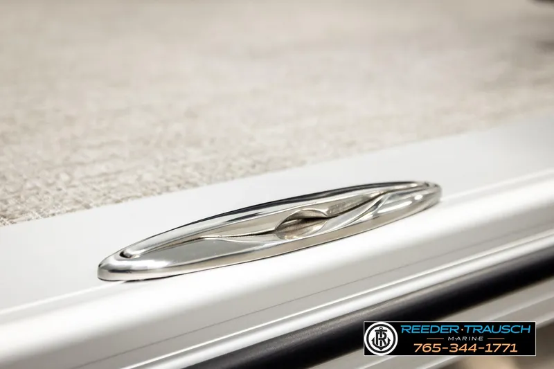 Slide: The Image of 2026 Avalon LSZ ENT boat cleat detail with Reeder Trausch Marine logo and contact information. - 58