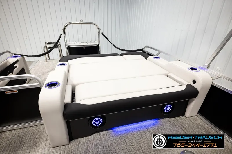 Slide: The Image of 2026 Avalon LSZ ENT boat interior with luxurious seating and LED cup holders. - 26