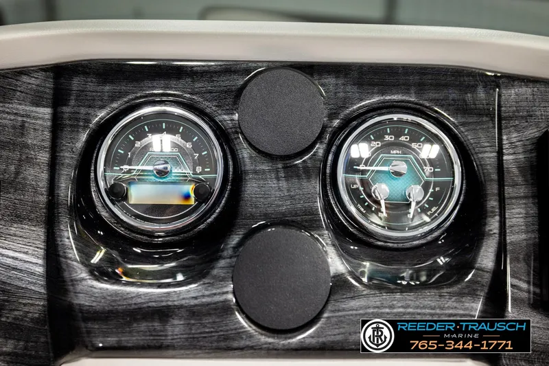 Slide: The Image of Dashboard of 2026 Avalon LSZ ENT with dual gauges, Reeder-Trausch Marine branding. - 40
