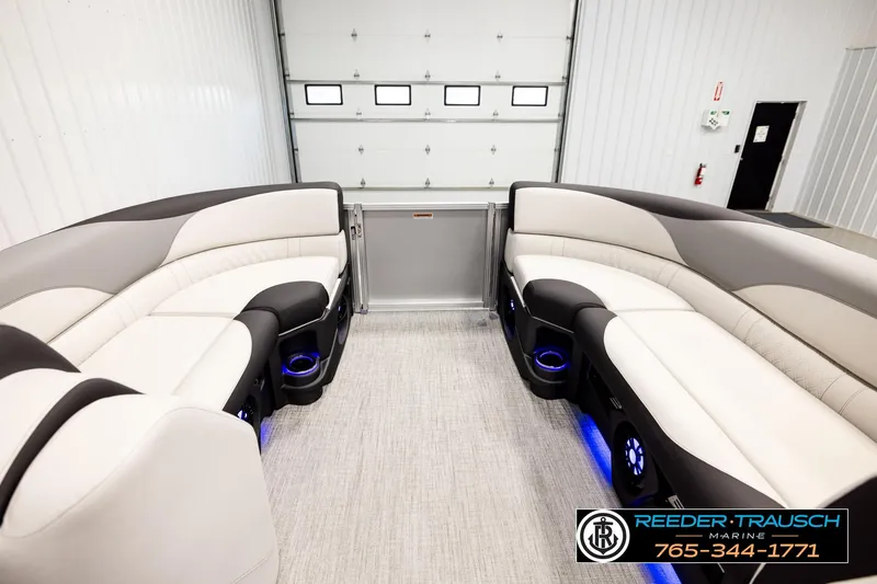 Slide: The Image of 2026 Avalon LSZ ENT pontoon boat interior with luxurious seating and ambient lighting. - 18
