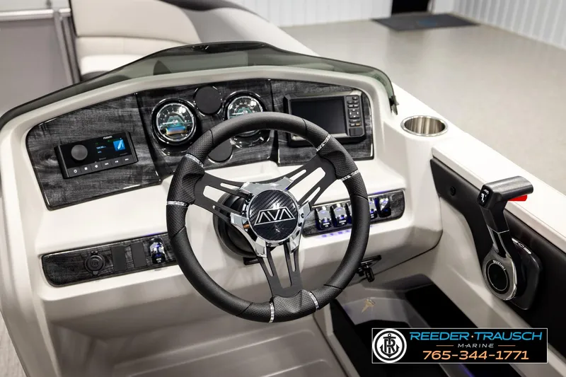 Slide: The Image of 2026 Avalon LSZ ENT boat dashboard with steering wheel and control panel. - 36