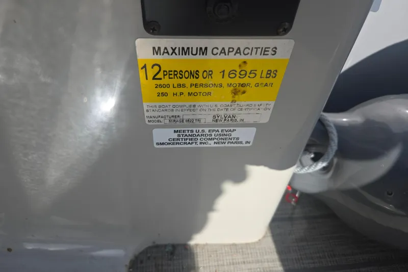Slide: The Image of Capacity label on 2018 Sylvan Mirage Cruise 8522 LZ LE boat, 12 persons or 1695 lbs. - 15