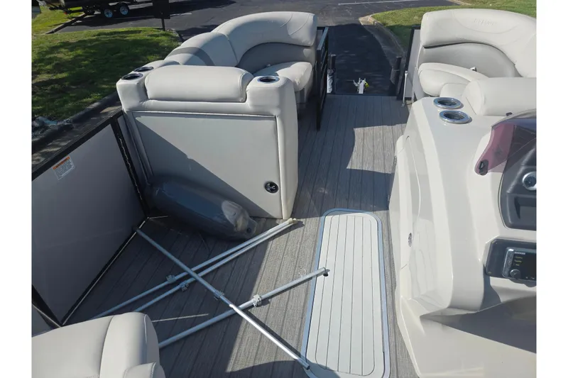 Slide: The Image of 2018 Sylvan Mirage Cruise 8522 LZ LE pontoon boat interior with plush seating and cup holders. - 24