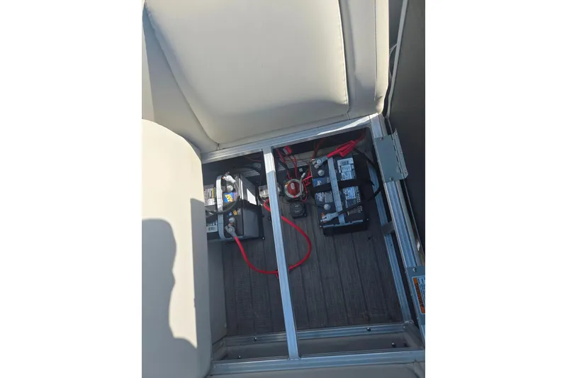 Slide: The Image of 2018 Sylvan Mirage Cruise 8522 LZ LE boat battery compartment with wiring. - 18