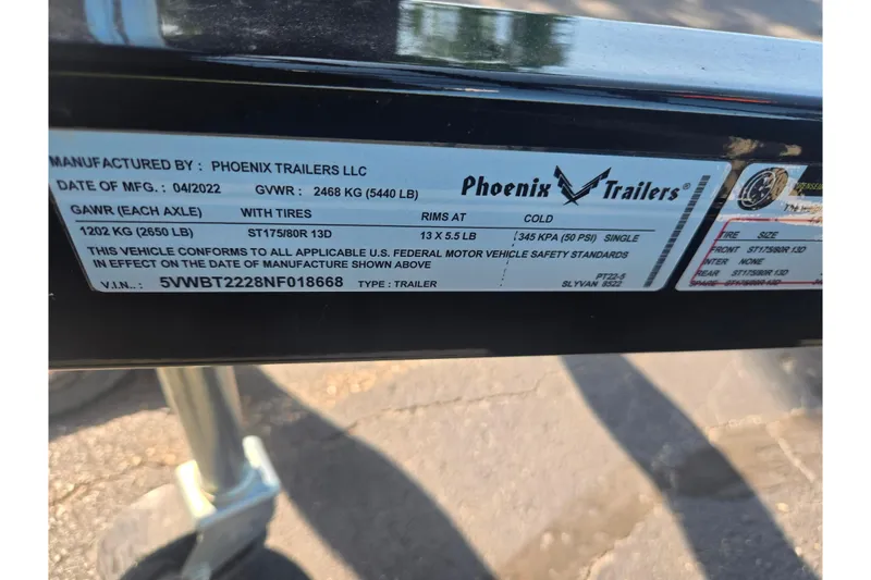 Slide: The Image of Label on Phoenix Trailers LLC, manufactured 04/2022, for Sylvan Mirage Cruise 8522 LZ LE. - 8