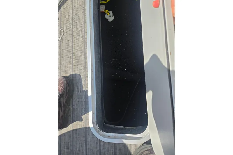 Slide: The Image of Open storage compartment on 2018 Sylvan Mirage Cruise 8522 LZ LE boat deck. - 25
