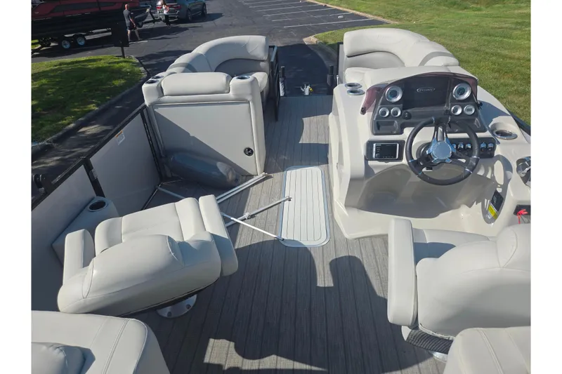 Slide: The Image of 2018 Sylvan Mirage Cruise 8522 LZ LE pontoon boat interior with plush seating and modern dashboard. - 22