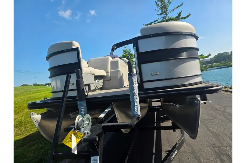 Slide: The Image of 2018 Sylvan Mirage Cruise 8522 LZ LE pontoon boat on trailer by a lake. - 6