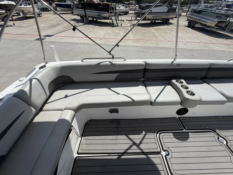 Slide: The Image of The image shows the spacious cockpit of a 2018 Hurricane 201 SS boat with gray upholstery. - 20