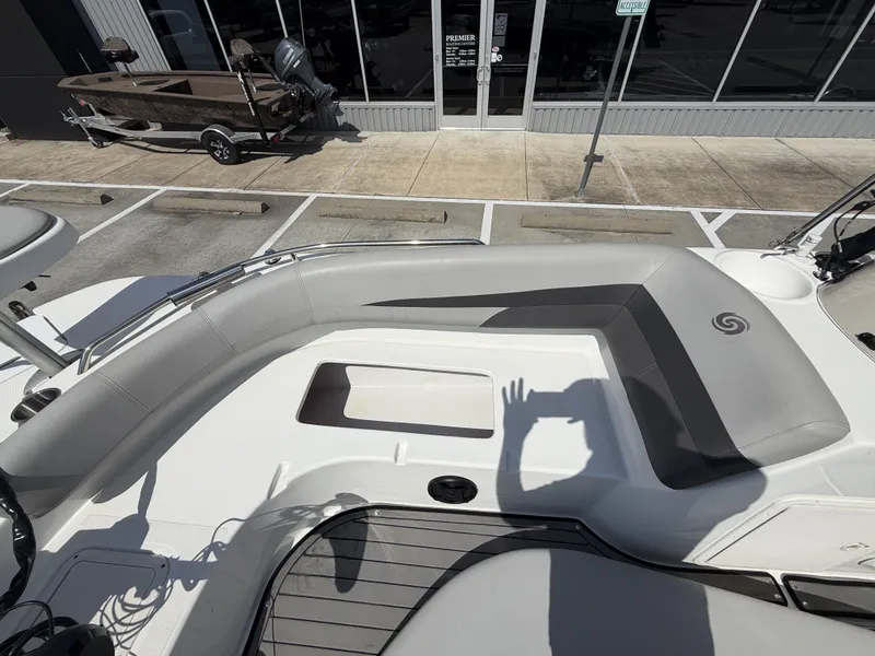 Slide: The Image of The image shows the cockpit of a 2018 Hurricane 201 SS boat with gray upholstery. - 29