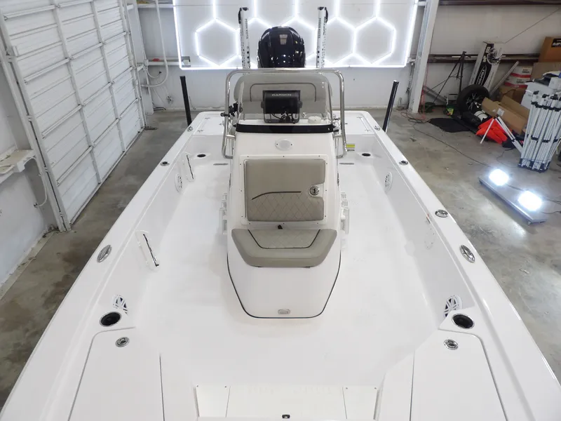 Slide: The Image of The image shows a 2022 Sportsman Tournament 214 Bay Boat in a garage. - 12