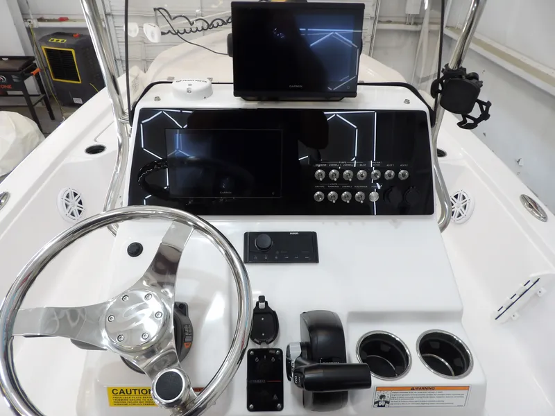 Slide: The Image of The image shows the helm of a 2022 Sportsman Tournament 214 Bay Boat with modern instruments. - 15