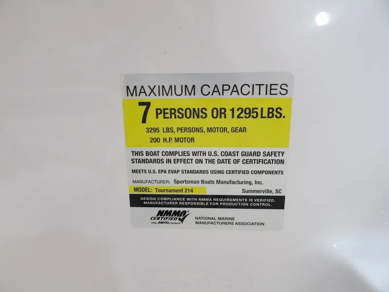 Slide: The Image of Label on a boat indicating a maximum capacity of 7 persons or 1295 pounds. - 21