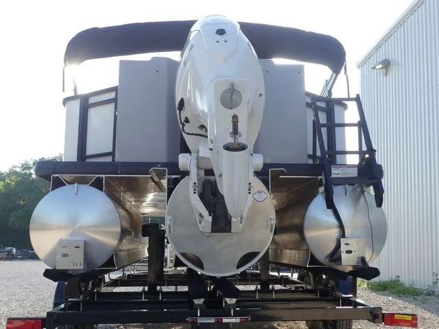 Slide: The Image of The image shows the rear of a Sweetwater SW 2086 FS pontoon boat with an outboard motor. - 6