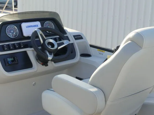 Slide: The Image of The image shows the helm of a Sweetwater SW 2086 FS boat with a Lowrance screen. - 31