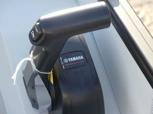 Slide: The Image of Close-up of a Yamaha throttle lever on a Sweetwater boat. - 48