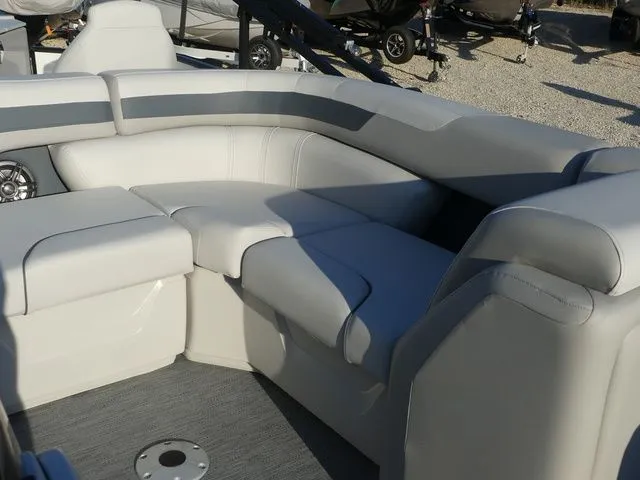 Slide: The Image of The image shows the seating area of a Sweetwater SW 2086 FS boat with gray upholstery. - 22