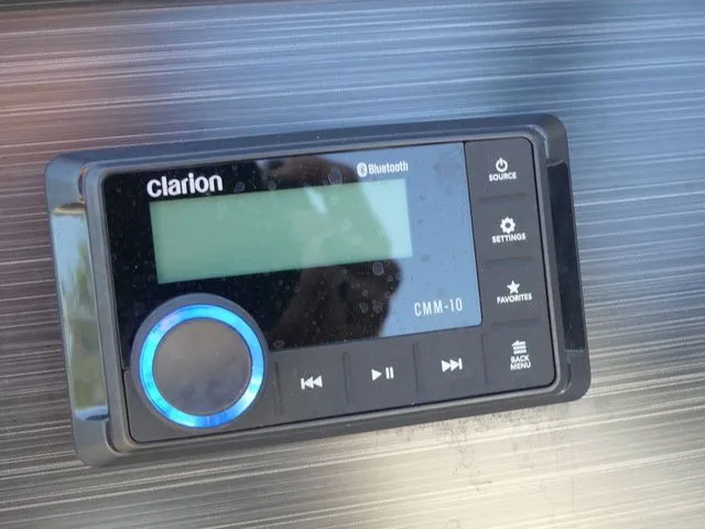 Slide: The Image of A Clarion CMM-10 Bluetooth audio system is embedded in a sleek surface. - 44