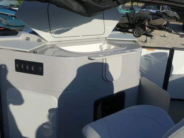 Slide: The Image of The image shows the cockpit of a Sweetwater SW 2086 FS boat with controls and seating area. - 51