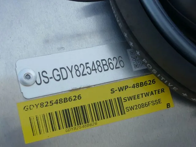 Slide: The Image of Close-up of a boat label showing serial number and model information. - 17