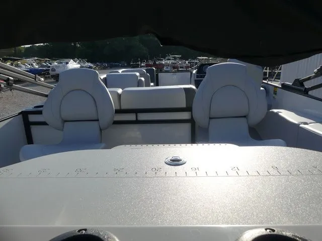 Slide: The Image of The image shows the interior of a 2026 Sweetwater SW 2086 FS boat with gray seating. - 27
