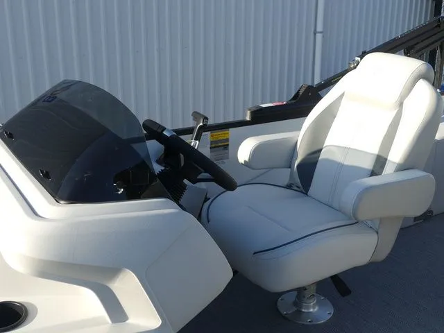 Slide: The Image of The 2026 Sweetwater SW 2086 FS features a modern helm with a comfortable, cushioned seat. - 23