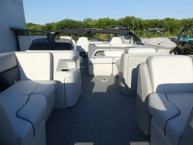 Slide: The Image of The image shows the spacious deck of a Sweetwater SW 2086 FS pontoon boat with comfortable seating. - 18