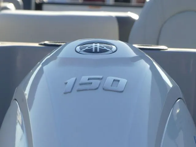 Slide: The Image of Close-up of a 150 horsepower outboard motor on a Sweetwater SW 2086 FS boat. - 8