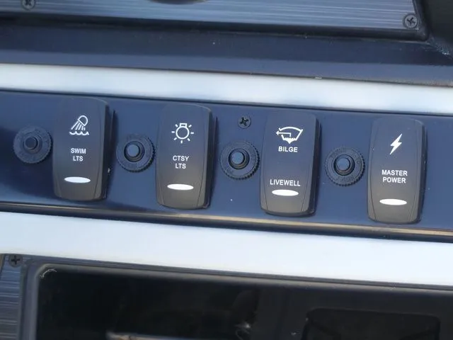 Slide: The Image of Close-up of a boat control panel with switches for various functions like lighting and bilge. - 47
