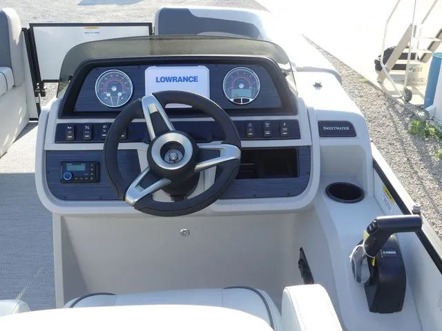 Slide: The Image of The image shows the helm of a Sweetwater SW 2086 FS boat with a Lowrance display. - 42