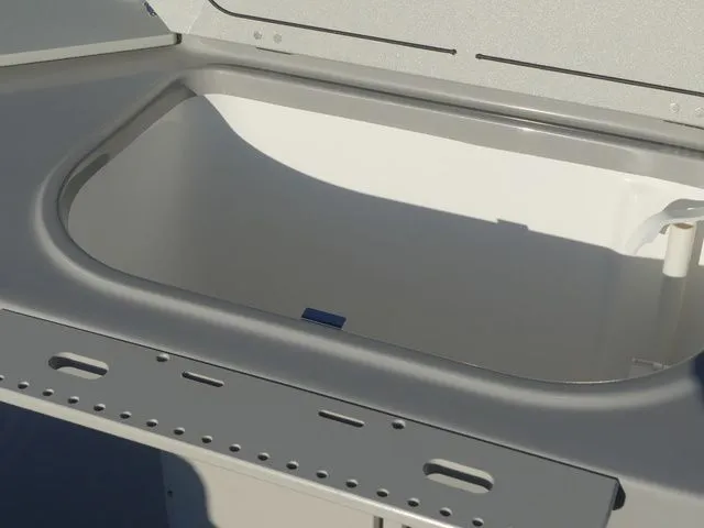 Slide: The Image of A gray boat component with a recessed compartment, possibly a storage area or sink. - 52