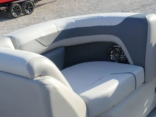Slide: The Image of The image shows a gray and white boat seat with an integrated speaker. - 34
