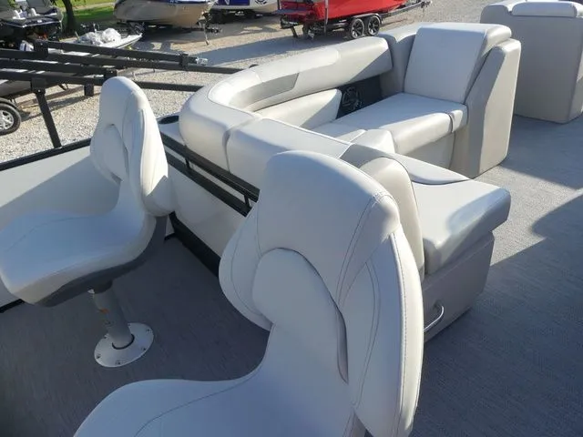 Slide: The Image of The image shows the interior of a 2026 Sweetwater SW 2086 FS boat with white seating. - 29