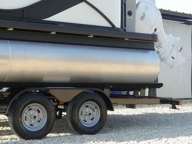 Slide: The Image of A 2026 Sweetwater SW 2086 FS pontoon boat on a trailer, featuring an outboard motor. - 12