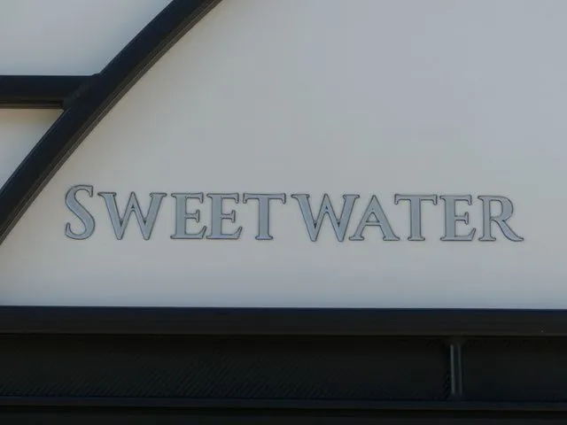 Slide: The Image of The image shows the Sweetwater logo on a boat. - 16