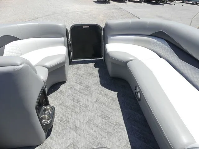Slide: The Image of Interior of a 2019 Manitou Encore 25 SR SHP with gray upholstered seating and carpeted floor. - 28